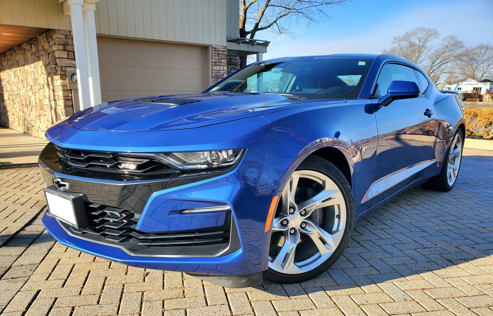 2019 Chevrolet Camaro coupe photographed from the front three-quarter angle.